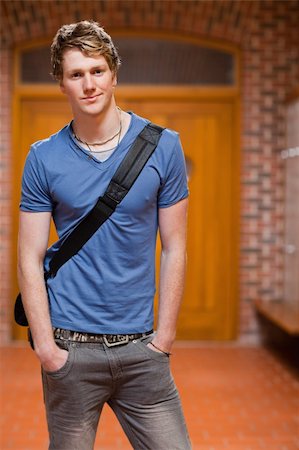 smart models male - Portrait of a handsome student standing up in a corridor Stock Photo - Budget Royalty-Free & Subscription, Code: 400-05677877