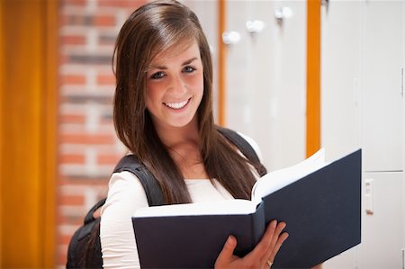 school hallway door - Smiling student holding a book in a corridor Stock Photo - Budget Royalty-Free & Subscription, Code: 400-05677901