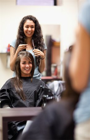 Portrait of a woman making a haircut standing up Stock Photo - Budget Royalty-Free & Subscription, Code: 400-05677933