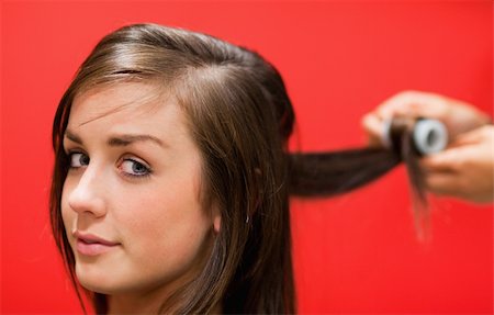 simsearch:400-08094595,k - Woman having her hair rolled with a curler Stock Photo - Budget Royalty-Free & Subscription, Code: 400-05677983
