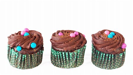 simsearch:400-05316582,k - Miniature decorated chocolate cupcakes isolated on white background Stock Photo - Budget Royalty-Free & Subscription, Code: 400-05678331