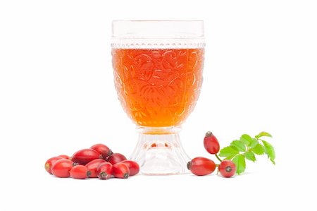 rosa canina - Rosehip wine with berries and leaves on a white background. Photographie de stock - Aubaine LD & Abonnement, Code: 400-05678774