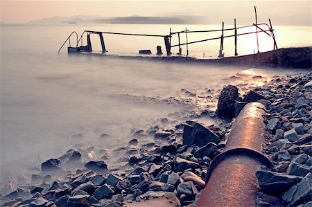 simsearch:400-05947442,k - Bathing pavilion (Chinese: æ³³æ£?) is a structure for bathing and swimming at a sea shore. The structure extended from shore into the sea with a large platform. Now, it is a history buildings in hong kong. Stockbilder - Microstock & Abonnement, Bildnummer: 400-05679084