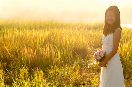 fields gold sunset - Asian bride at outdoor in a morning surrounding by golden sunlight Stock Photo - Budget Royalty-Free & Subscription, Code: 400-05679182