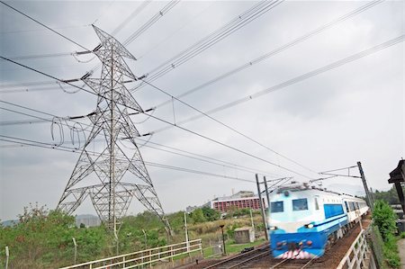 electricity waste - passenger trains in motion and power tower on background Stock Photo - Budget Royalty-Free & Subscription, Code: 400-05679359