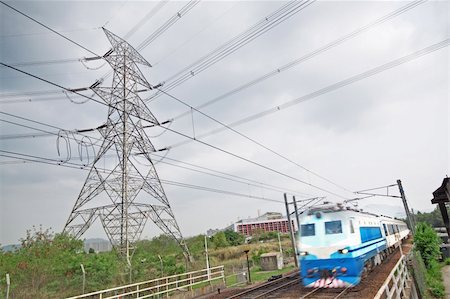 passenger trains in motion and power tower on background Stock Photo - Budget Royalty-Free & Subscription, Code: 400-05679359