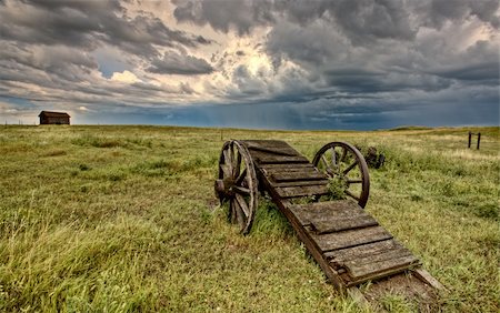 simsearch:400-05102252,k - Old Prairie Wheel Cart Saskatchewan Canada field Stock Photo - Budget Royalty-Free & Subscription, Code: 400-05679839