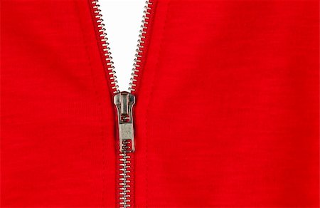 Zip of a red cotton sweater, white background Photographie de stock - Aubaine LD & Abonnement, Code: 400-05670043