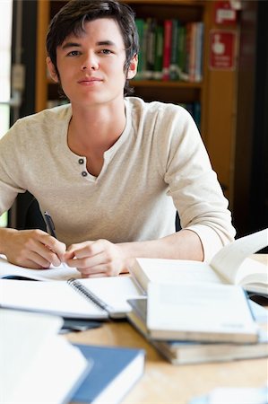 simsearch:400-05678093,k - Serious student working in a library Stock Photo - Budget Royalty-Free & Subscription, Code: 400-05670062