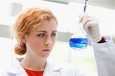 Science student mixing liquids in a laboratory Stock Photo - Budget Royalty-Free & Subscription, Code: 400-05670430