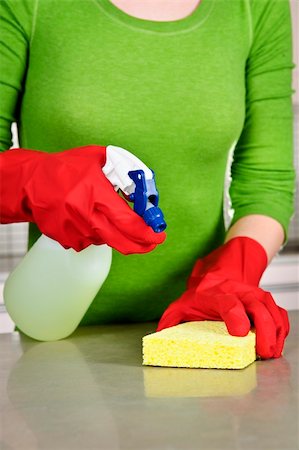 Girl cleaning kitchen  with sponge and rubber gloves Stock Photo - Budget Royalty-Free & Subscription, Code: 400-05670556