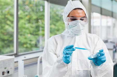 pharmacy lab - Protected science student dropping blue liquid in a Petri dish in a laboratory Stock Photo - Budget Royalty-Free & Subscription, Code: 400-05670593