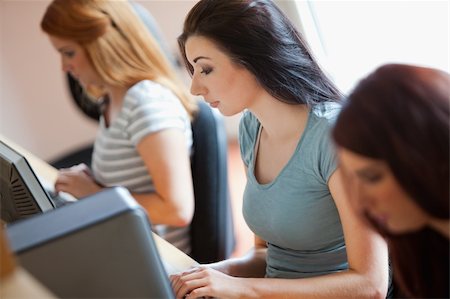 simsearch:400-05684311,k - Studious young women working with computers in an IT room Stock Photo - Budget Royalty-Free & Subscription, Code: 400-05670655