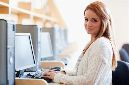 simsearch:400-07267978,k - Young student posing with a computer in an IT room Stock Photo - Budget Royalty-Free & Subscription, Code: 400-05670668