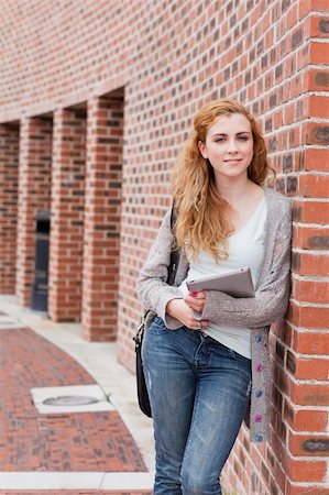 students tablets outside - Portrait of a student with a tablet computer standing outside a building Stock Photo - Budget Royalty-Free & Subscription, Code: 400-05670713