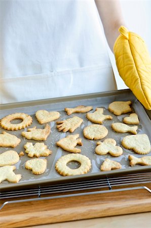 Chef  holding cookie tray with fresh baked homemade shortbread cookies Stock Photo - Budget Royalty-Free & Subscription, Code: 400-05670738