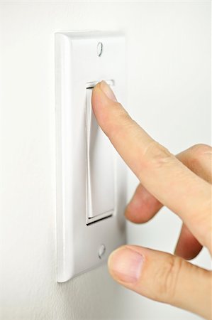 Finger turning white light switch on or off Stock Photo - Budget Royalty-Free & Subscription, Code: 400-05670763