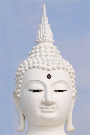 Close up shot of the smile Buddha's face. Photographie de stock - Aubaine LD & Abonnement, Code: 400-05670947