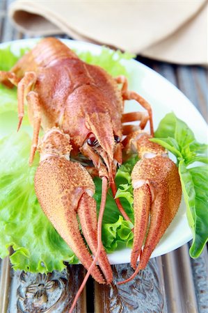 Whole cooked lobster with salad garnish on a plate Stock Photo - Budget Royalty-Free & Subscription, Code: 400-05671035