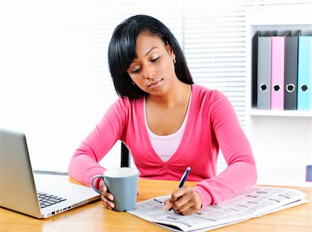 Young black female student looking in newspaper for job Stock Photo - Budget Royalty-Free & Subscription, Code: 400-05671210