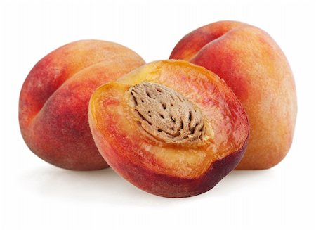 simsearch:400-04423639,k - Peaches with half isolated on white background Stock Photo - Budget Royalty-Free & Subscription, Code: 400-05671916