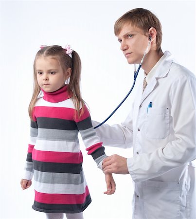 The doctor in a white dressing gown and the little girl at it on reception Stock Photo - Budget Royalty-Free & Subscription, Code: 400-05672153