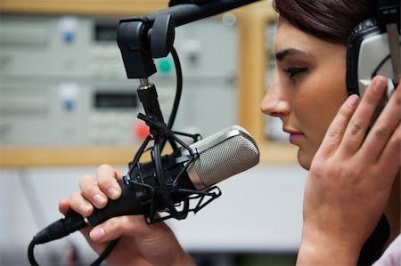Close up of a cute singer recording a track in a studio Stock Photo - Budget Royalty-Free & Subscription, Code: 400-05672213