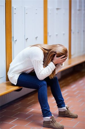 Portrait of a depressed student sitting on a bench in a corridor Stock Photo - Budget Royalty-Free & Subscription, Code: 400-05672249