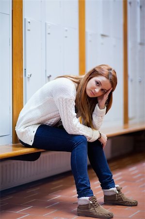 Portrait of a sad student sitting on a bench looking at the camera Stock Photo - Budget Royalty-Free & Subscription, Code: 400-05672250
