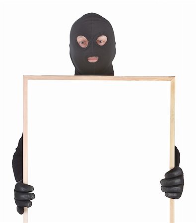 evil hand - bandit with hollow frame isolated on white background Stock Photo - Budget Royalty-Free & Subscription, Code: 400-05672569