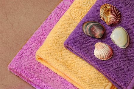 simsearch:400-04799995,k - pile of new yellow, magenta and purple cotton towels with a shells Stock Photo - Budget Royalty-Free & Subscription, Code: 400-05673222