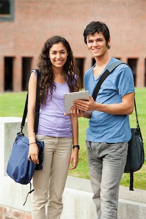students tablets outside - Portrait of a couple holding a tablet computer outside a building Stock Photo - Budget Royalty-Free & Subscription, Code: 400-05684098