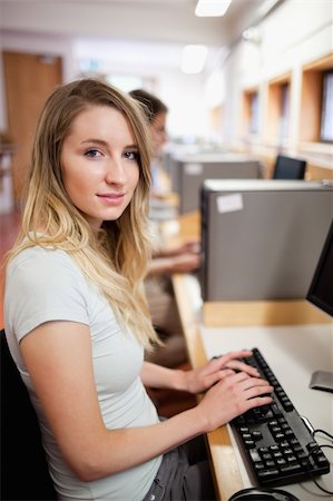 Portrait of a student working with a computer in an IT room Stock Photo - Budget Royalty-Free & Subscription, Code: 400-05684111