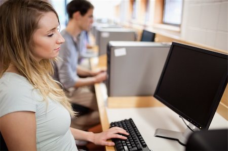simsearch:400-05684311,k - Focused student working with a computer in an IT room Stock Photo - Budget Royalty-Free & Subscription, Code: 400-05684113