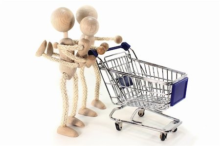 simsearch:400-08407242,k - A wooden doll family with Shopping Cart Photographie de stock - Aubaine LD & Abonnement, Code: 400-05684126