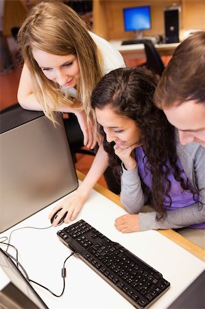 simsearch:400-05684311,k - Portrait of a students using a computer in an IT room Stock Photo - Budget Royalty-Free & Subscription, Code: 400-05684136