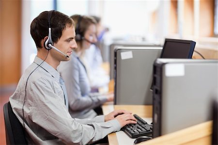 Customer assistant working in a call center Stock Photo - Budget Royalty-Free & Subscription, Code: 400-05684300