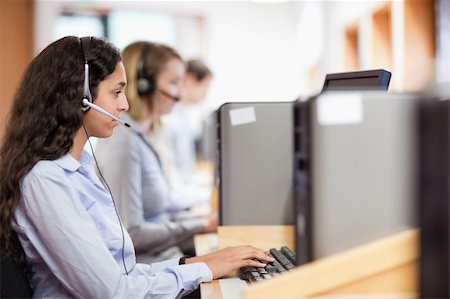 Customer assistant working with a computer in call center Stock Photo - Budget Royalty-Free & Subscription, Code: 400-05684301