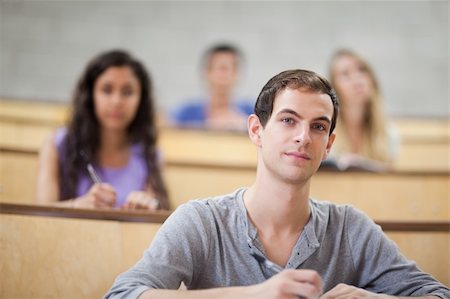 simsearch:400-05684361,k - Students listening during a lecture in an amphitheater Stock Photo - Budget Royalty-Free & Subscription, Code: 400-05684322