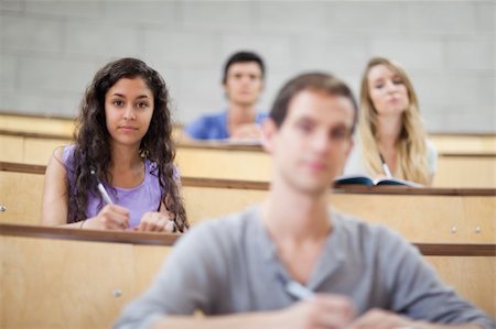 simsearch:400-05684361,k - Students listening during a lecture in an amphitheater Stock Photo - Budget Royalty-Free & Subscription, Code: 400-05684323