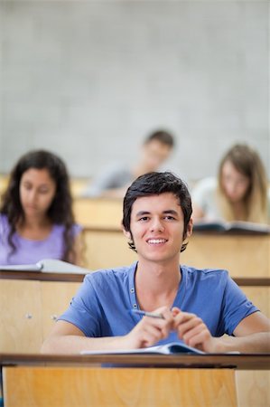 simsearch:400-05684331,k - Portrait of focused students during a lecture with the camera focus on the foreground Photographie de stock - Aubaine LD & Abonnement, Code: 400-05684330