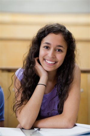simsearch:400-05684320,k - Portrait of smiling student leaning on her hand in an amphitheater Stock Photo - Budget Royalty-Free & Subscription, Code: 400-05684384