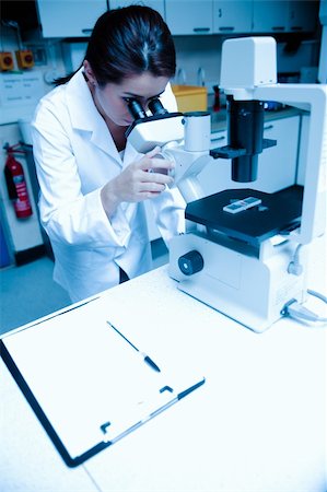 simsearch:400-06078063,k - Portrait of a scientist looking in a microscope in a laboratory Stock Photo - Budget Royalty-Free & Subscription, Code: 400-05684506