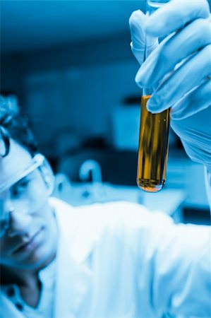 Portrait of a male scientist looking at a test tube in a laboratory Stock Photo - Budget Royalty-Free & Subscription, Code: 400-05684510