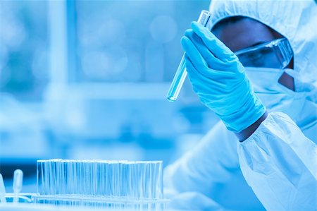 Protected scientist looking at a dangerous liquid in test tubes in a  sterile laboratory Stock Photo - Budget Royalty-Free & Subscription, Code: 400-05684527