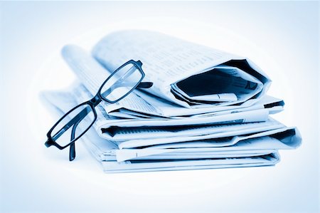 simsearch:400-04303764,k - Newspapers and black glasses against a white a background Stock Photo - Budget Royalty-Free & Subscription, Code: 400-05684541