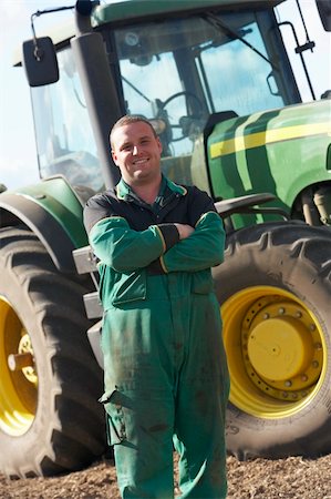 driver tractor - Driver Standing In Front Of Tractor Stock Photo - Budget Royalty-Free & Subscription, Code: 400-05686417