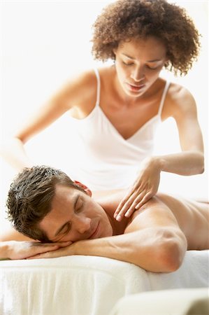 simsearch:400-05686719,k - Young Man Enjoying Massage At Spa Fotografie stock - Microstock e Abbonamento, Codice: 400-05686670