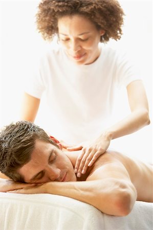 simsearch:400-05686719,k - Young Man Enjoying Massage At Spa Fotografie stock - Microstock e Abbonamento, Codice: 400-05686671