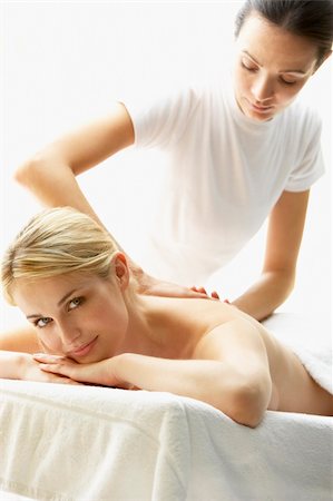 simsearch:400-05686719,k - Young Woman Enjoying Massage Fotografie stock - Microstock e Abbonamento, Codice: 400-05686684